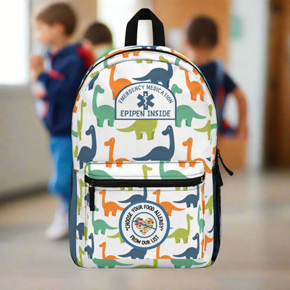 Backpack with dinosaur pattern and emergency medical labels on a white background