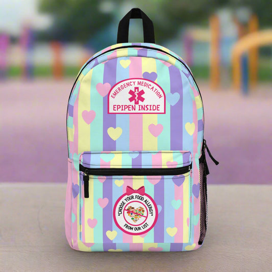 Backpack with colorful striped pattern and emergency medical labels on a white background