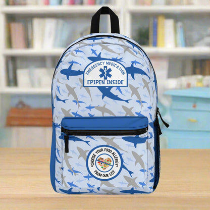 Backpack with shark pattern and emergency medical labels on a white background