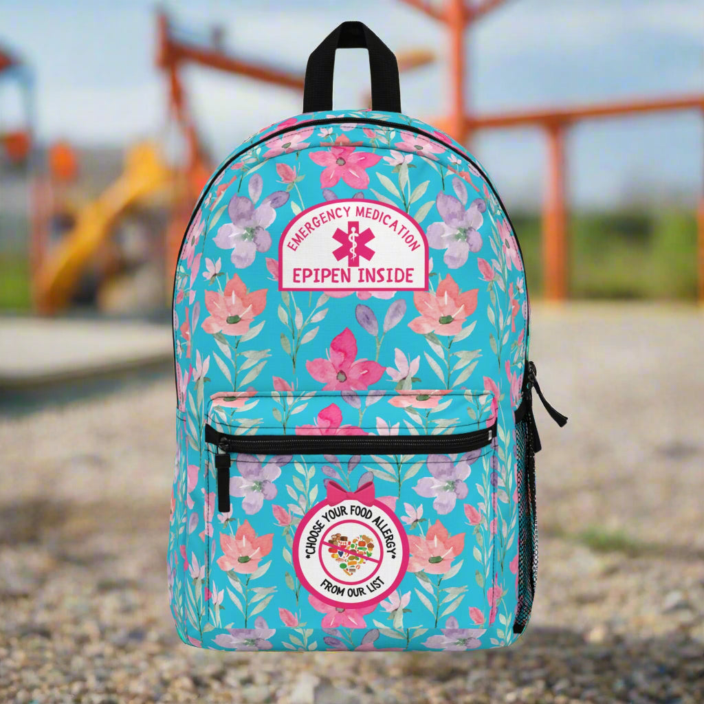 Floral backpack with emergency medication labels on a white background