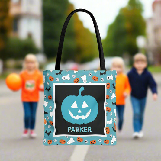 Halloween-themed tote bag with a pumpkin design and text.