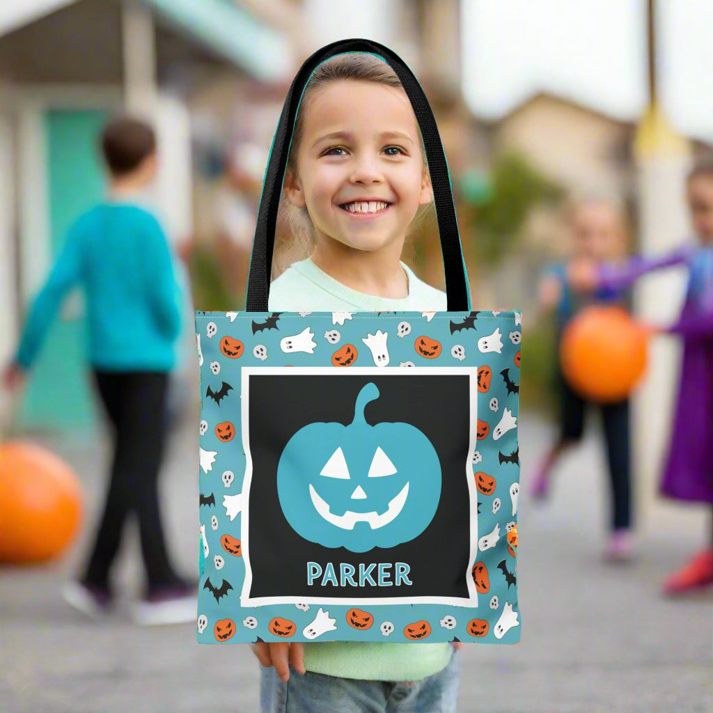 Halloween-themed tote bag with a pumpkin design and name.